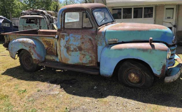 1953 chevy truck with weathered patina paint job on Craiyon